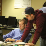 Living lab staff and Black Friday imaging project managers Joe Walters and Nick Barnett create tracking system for Simon Property Group imaging project.